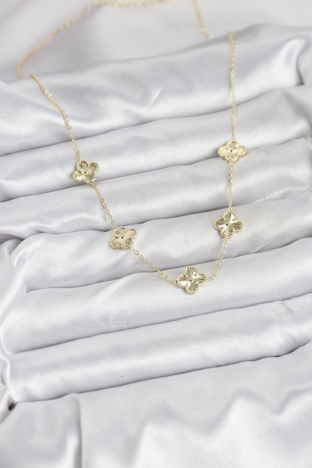 Golden brass clover style necklace for the elegant woman