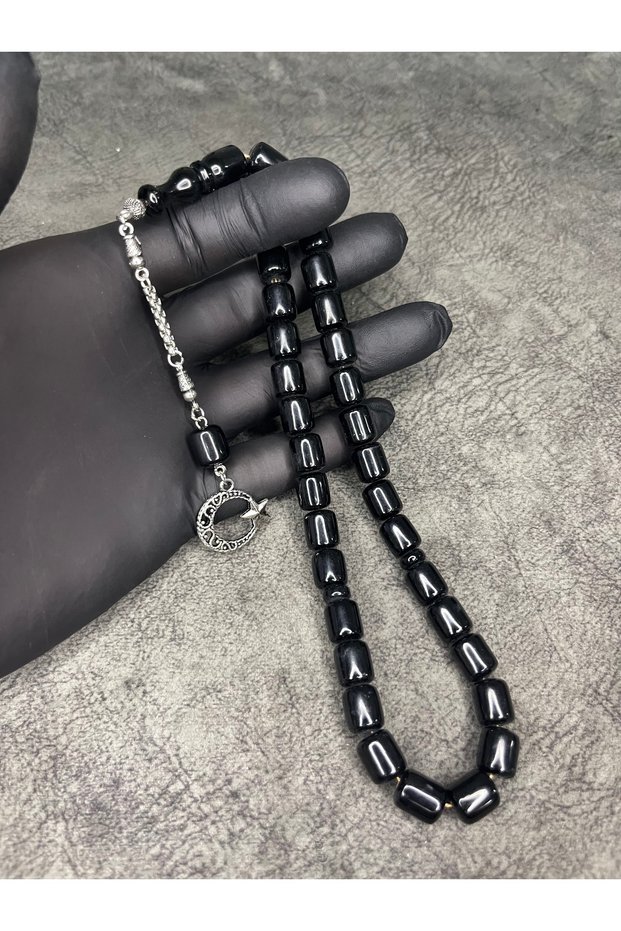 سبحة كهرمانية سوداء فاخرة مضغوطة على شكل كبسولة