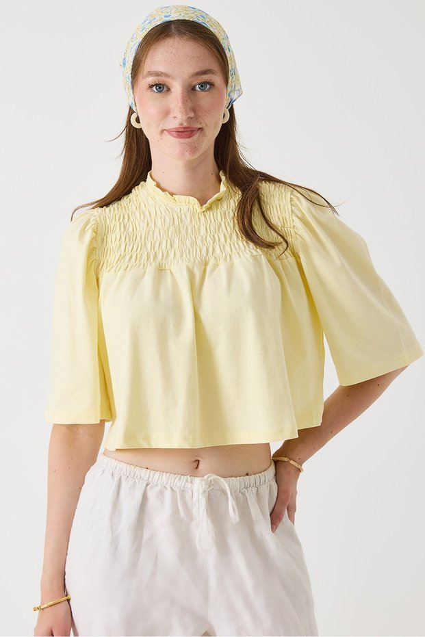 Yellow Crew Neck Short Sleeve Crop Form Blouse with Pleated Detail on the Chest and Comfortable Cut