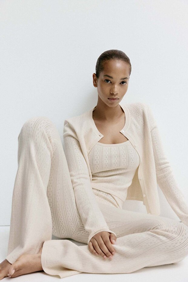 Flared pointelle-knit trousers