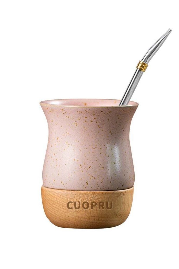 Ceramic cup on wooden base with straw brush, mate tea cup, coffee cup