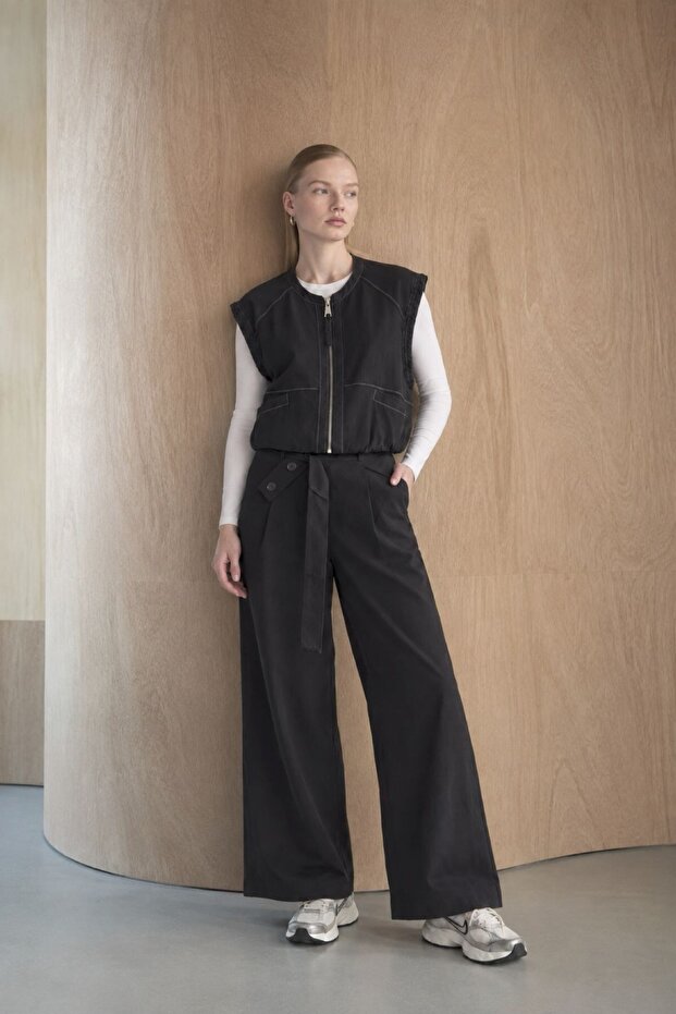Blue zippered vest with pocket detail