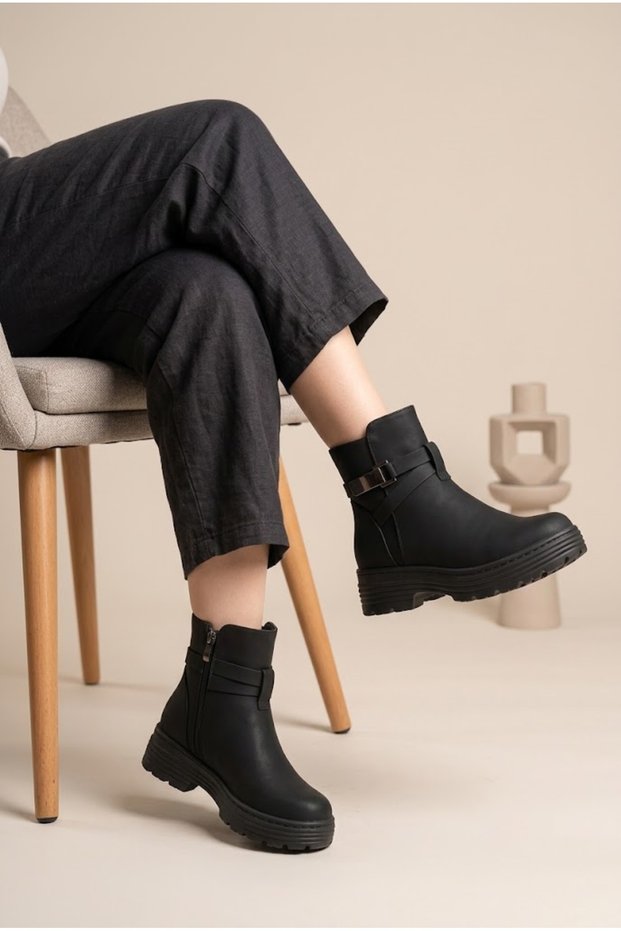 Women's Matte Leather Textured Cross Belt and Buckle Detailed Thick Serrated Sole Casual Boots