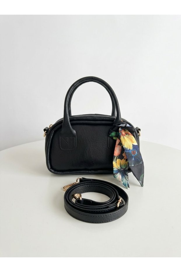 Black color hand and shoulder bag with scarf model.