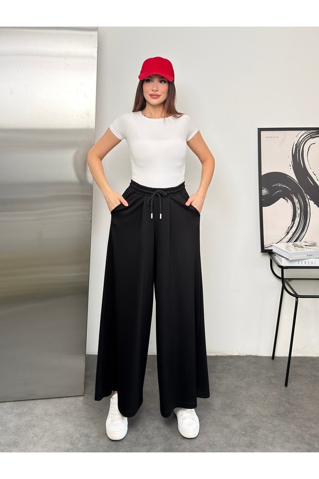Wide Cut Flared Trousers with Elastic Waist and Double Skirt