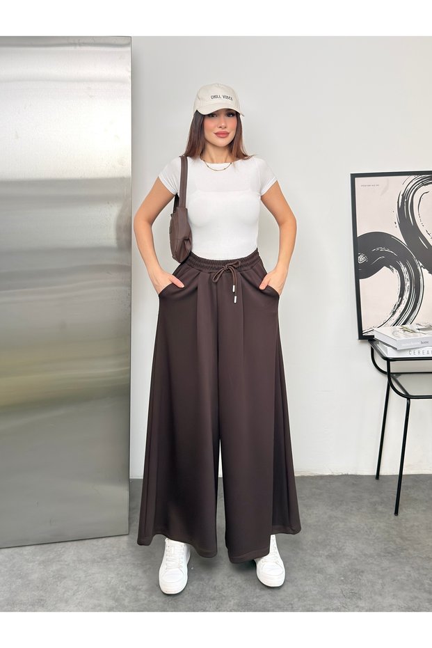 Wide Cut Flared Trousers with Elastic Waist and Double Skirt