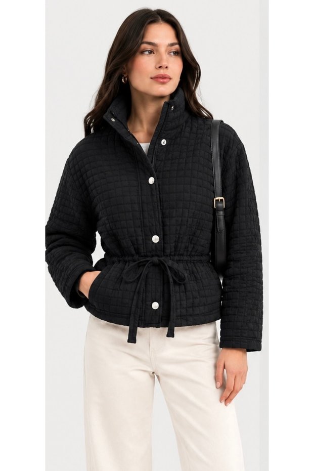 Women's Black Quilted Jacket with Stand-Up Collar, Drawstring Waist, Snap Buttons, and Zipper.