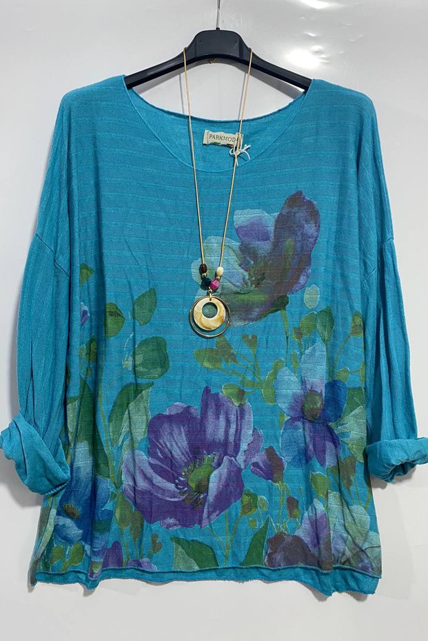 Women's Italian Round Neck Oversized Loose Blouse with Printed Floral Pattern and Necklace Accessory.