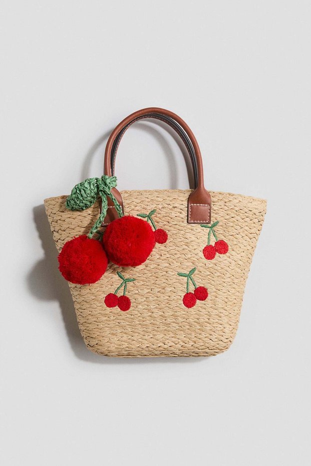 Appliquéd straw bag