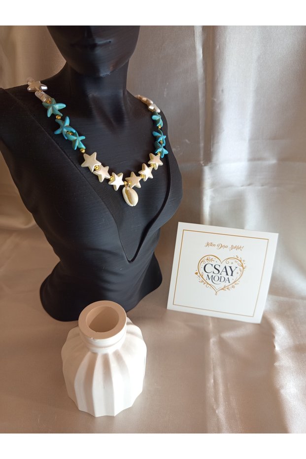 NECKLACE WITH A STAR AND A PEARL