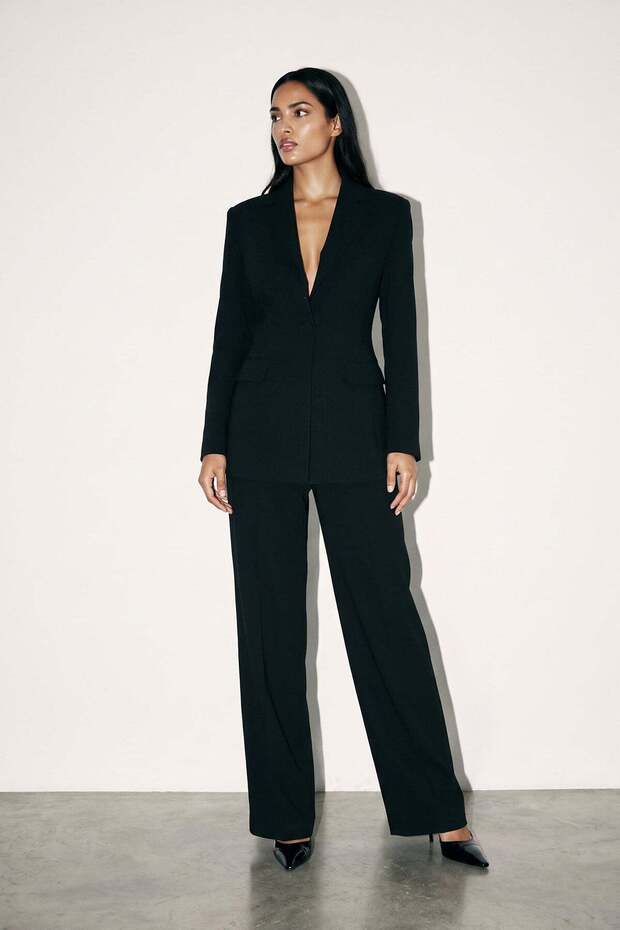 Black Jacket with Pocket Detail and Loose Fit Pants with Button Details