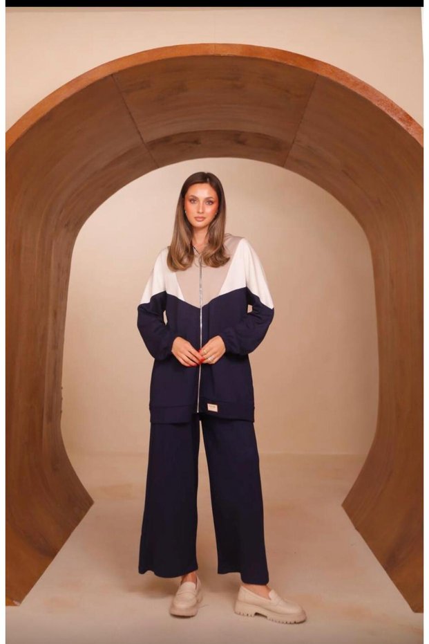 Women's two-piece set with a modal-textured paneled top, ruffles, and a hood
