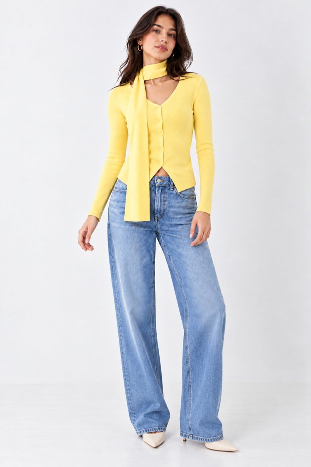 Yellow v-neck long-sleeved blouse with scarf detail.