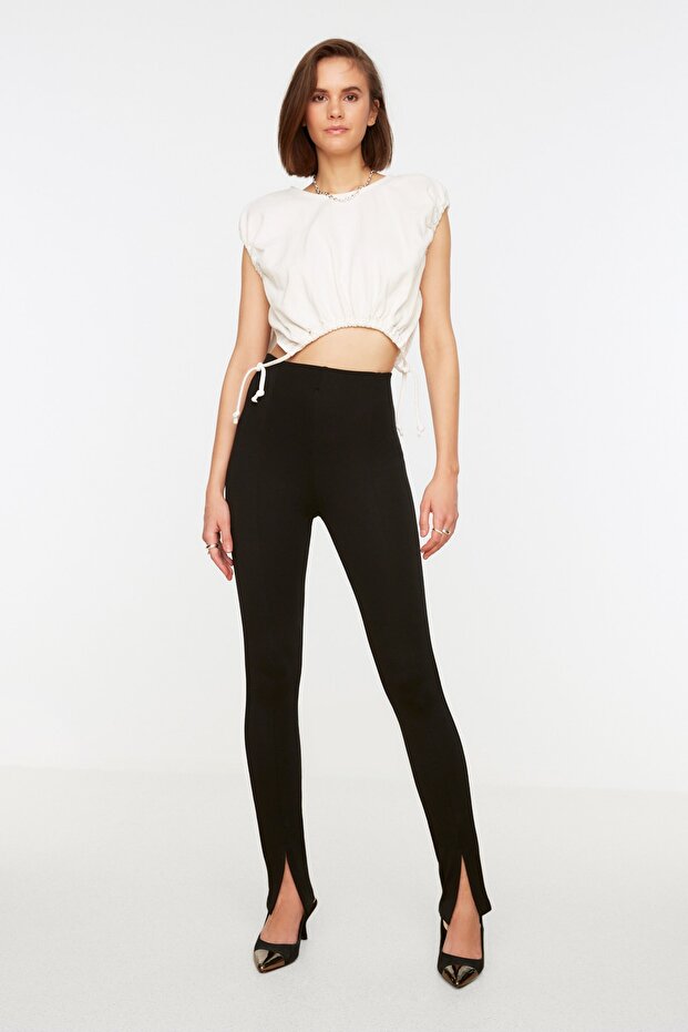 Schwarze Interlock-Strick-Leggings mit hoher Taille und geschlitzten Beinen TWOAW21PL0263