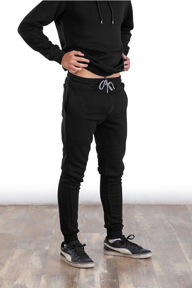 رجل ذو قاع واحد أسود بثلاثة خيوط مكبل للساق - 1