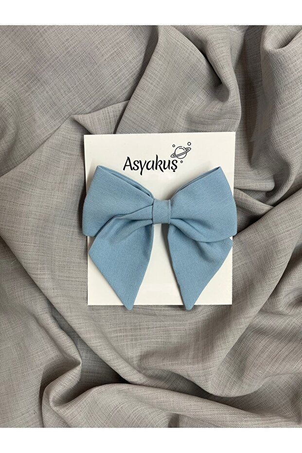 مشبك أوتوماتيكي بفيونكة زرقاء فاتحة - 1