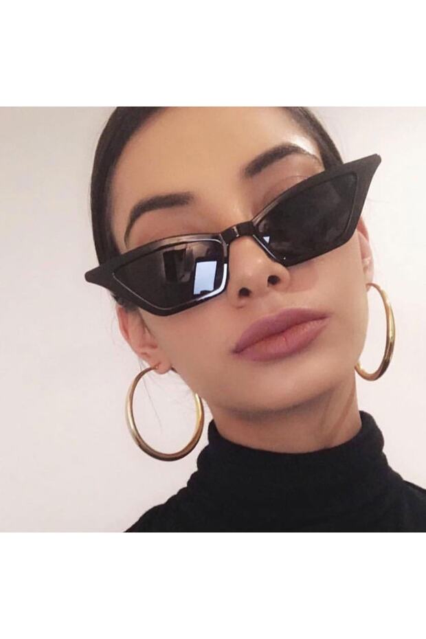 نظارة شمسية نسائية ذات إطار أسود بتصميم عين القطة