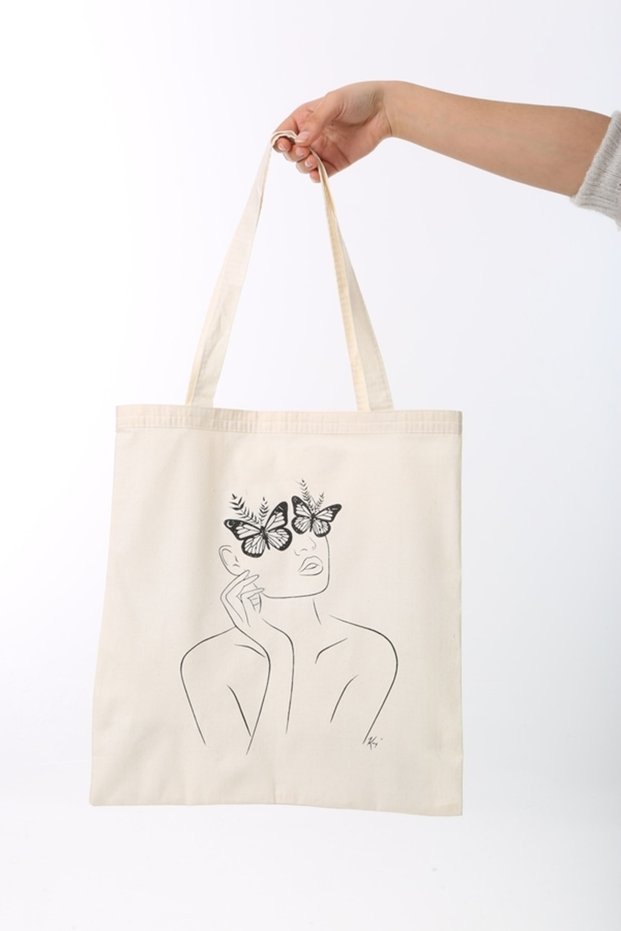 Woman with Cloth Bag and Butterfly Glasses