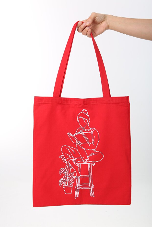 Woman Sitting on Stool with Cloth Bag