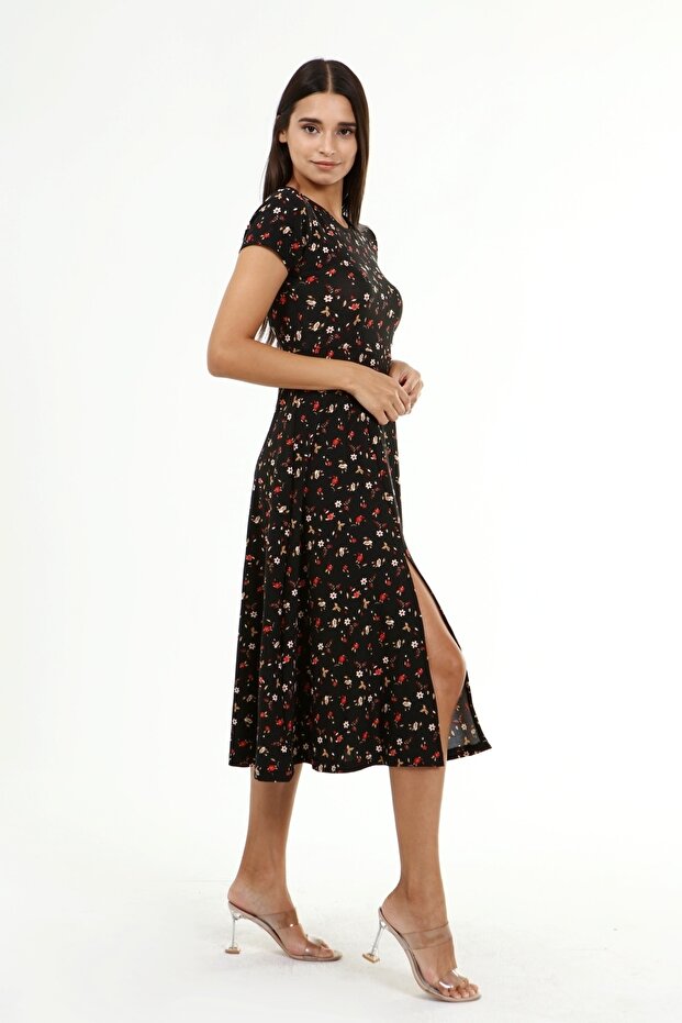 فستان طويل بفتحة منقوشة بالزهور باللون الأسود للنساء