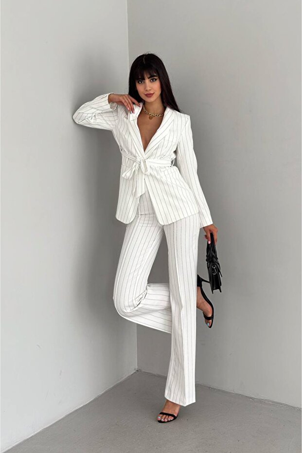 Damska marynarka z kołnierzem szalowym i kieszeniami, wiązana, z elastycznymi spodniami i rurkami - 1