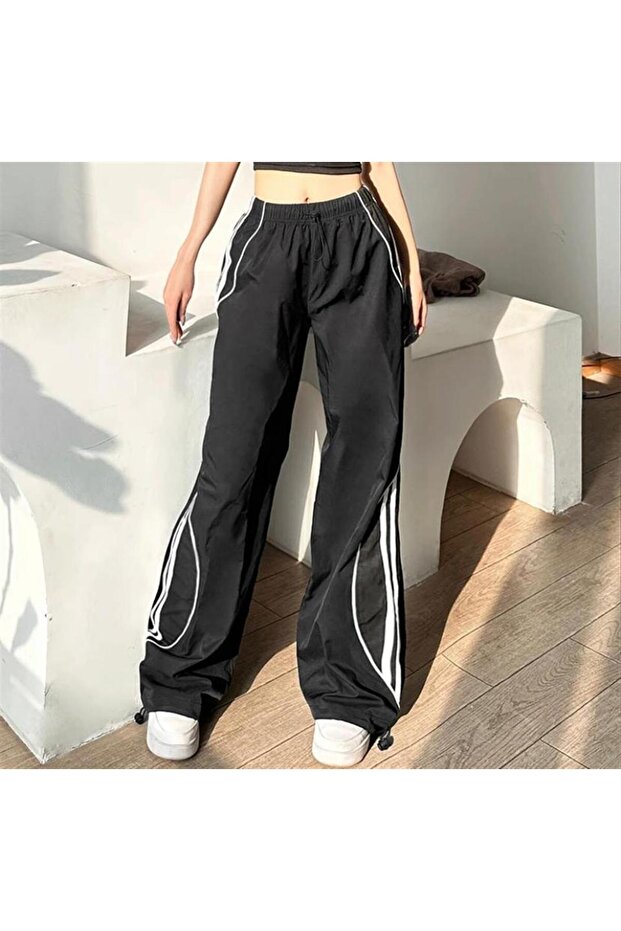 black striped parachute fabric trend sweatpants