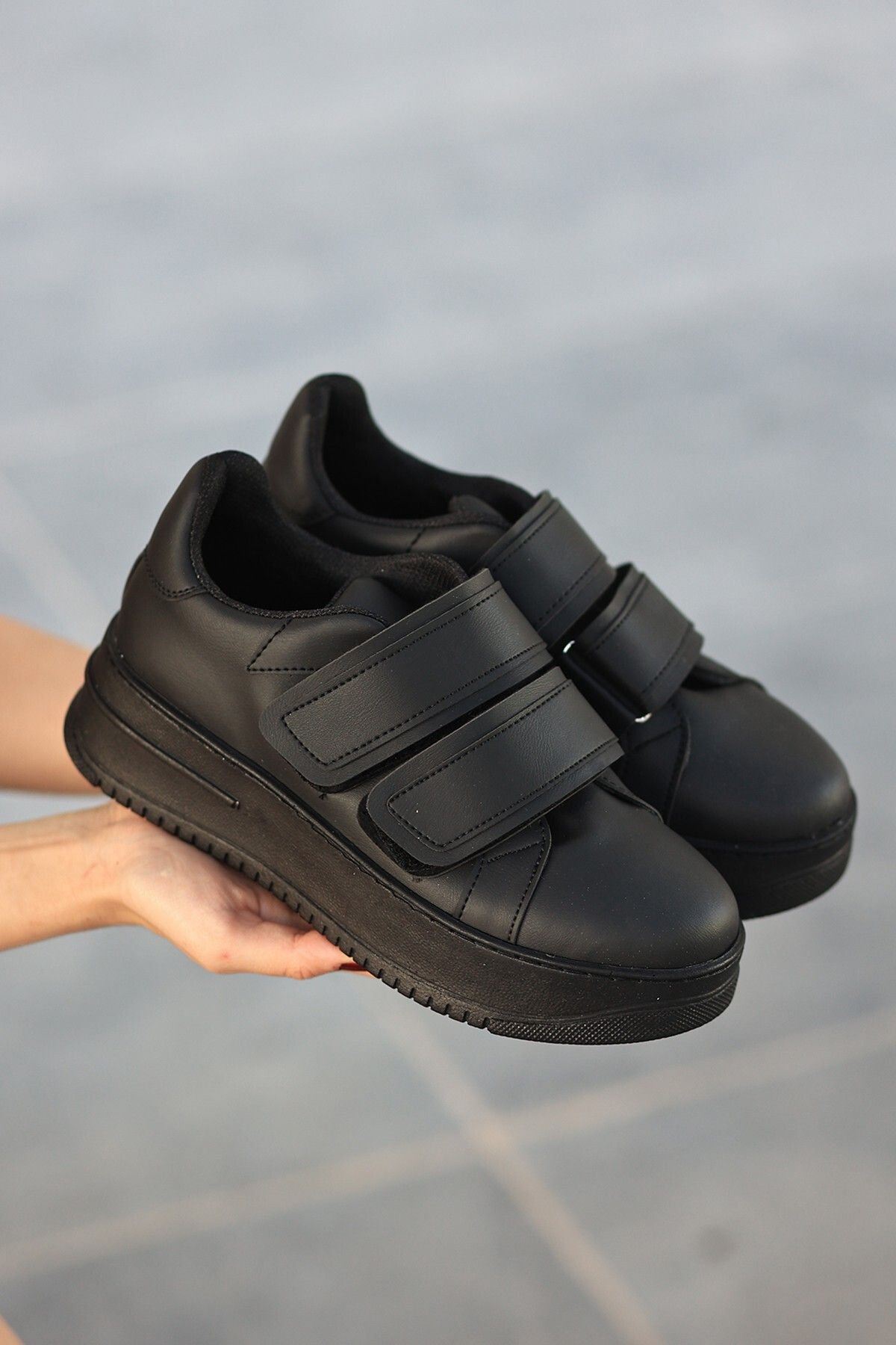 Black velcro top sports shoes
