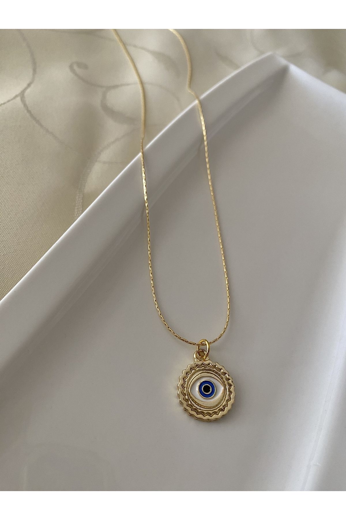 Gold eye deals jewelry