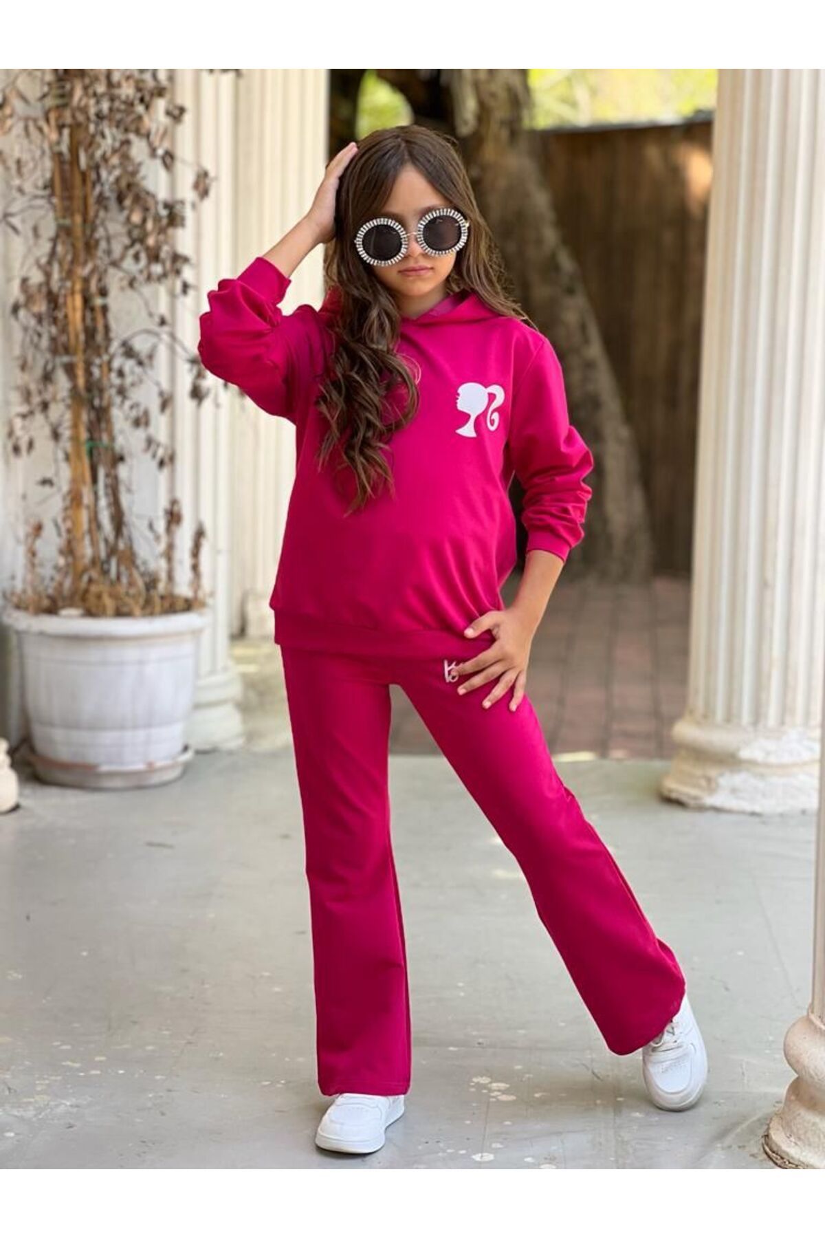 Girl top wearing tracksuit