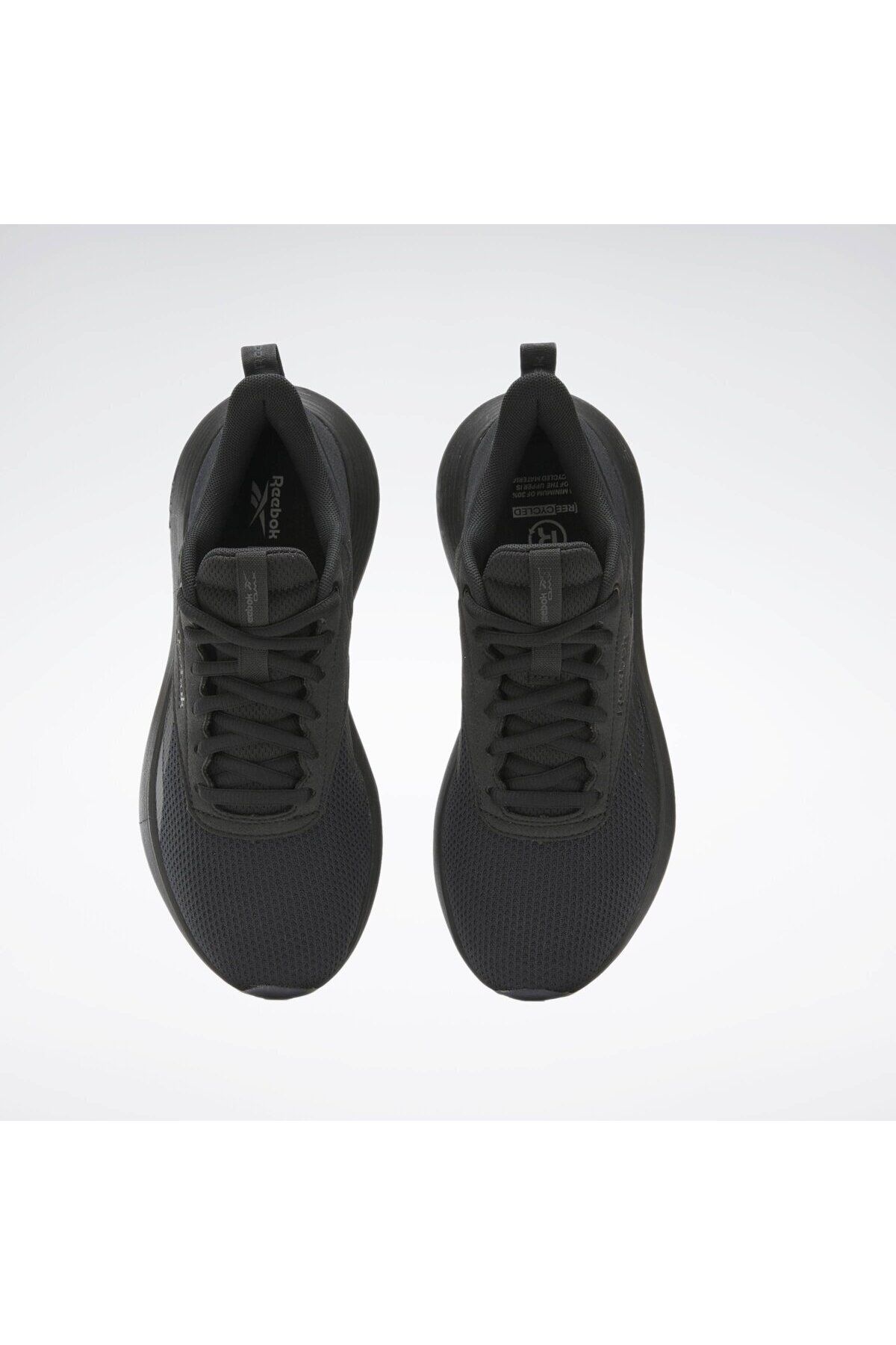 Reebok DMX COMFORT + کفش های زن سیاه در حال راه رفتن