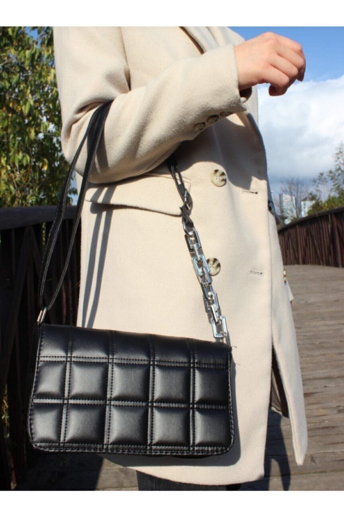 Black quilted purse with chain strap store