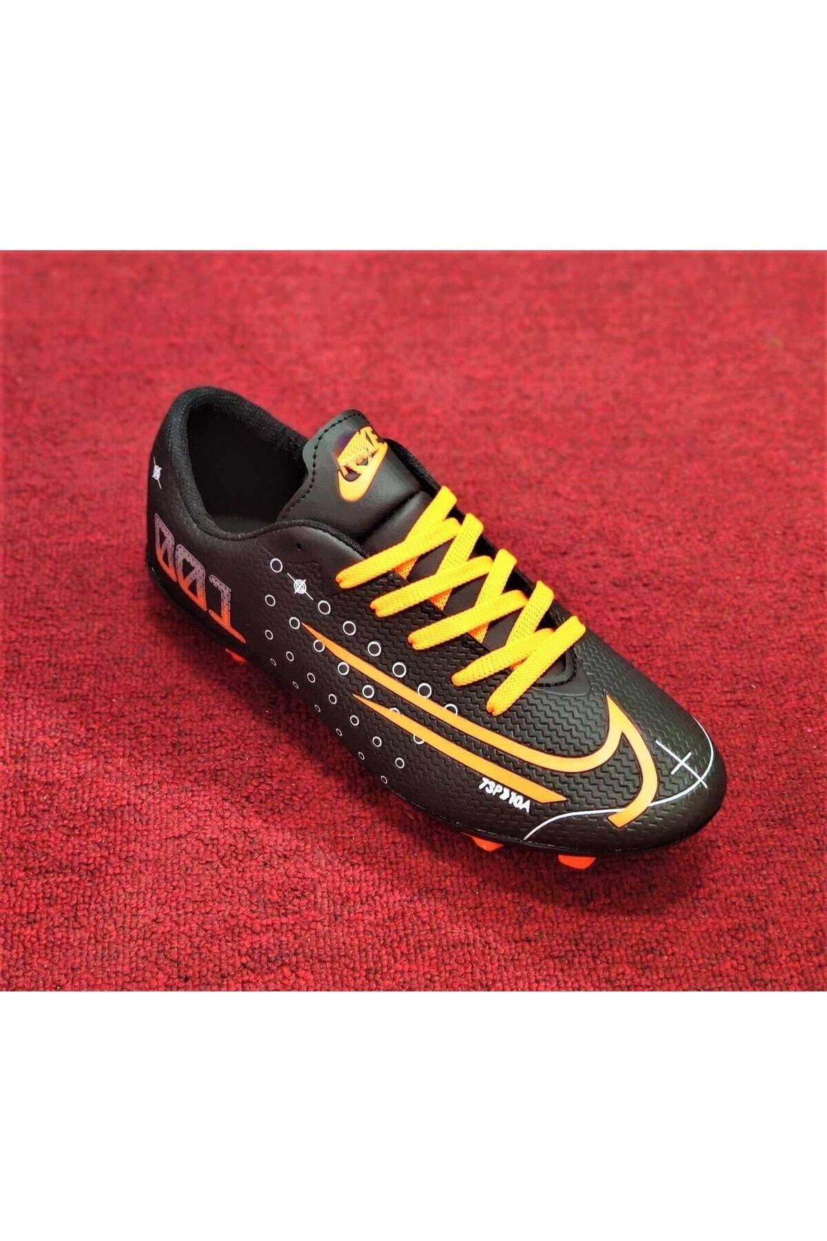 Orange and black football cleats youth 2025