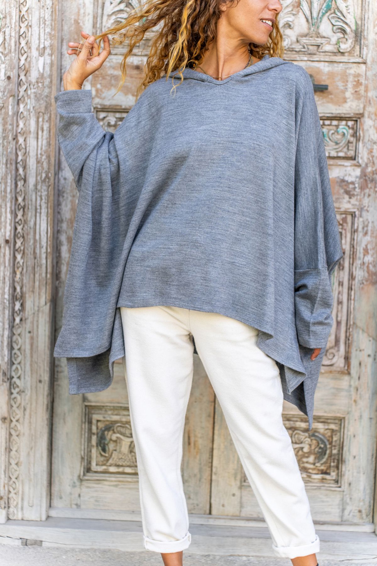 Asymmetrical online poncho sweater