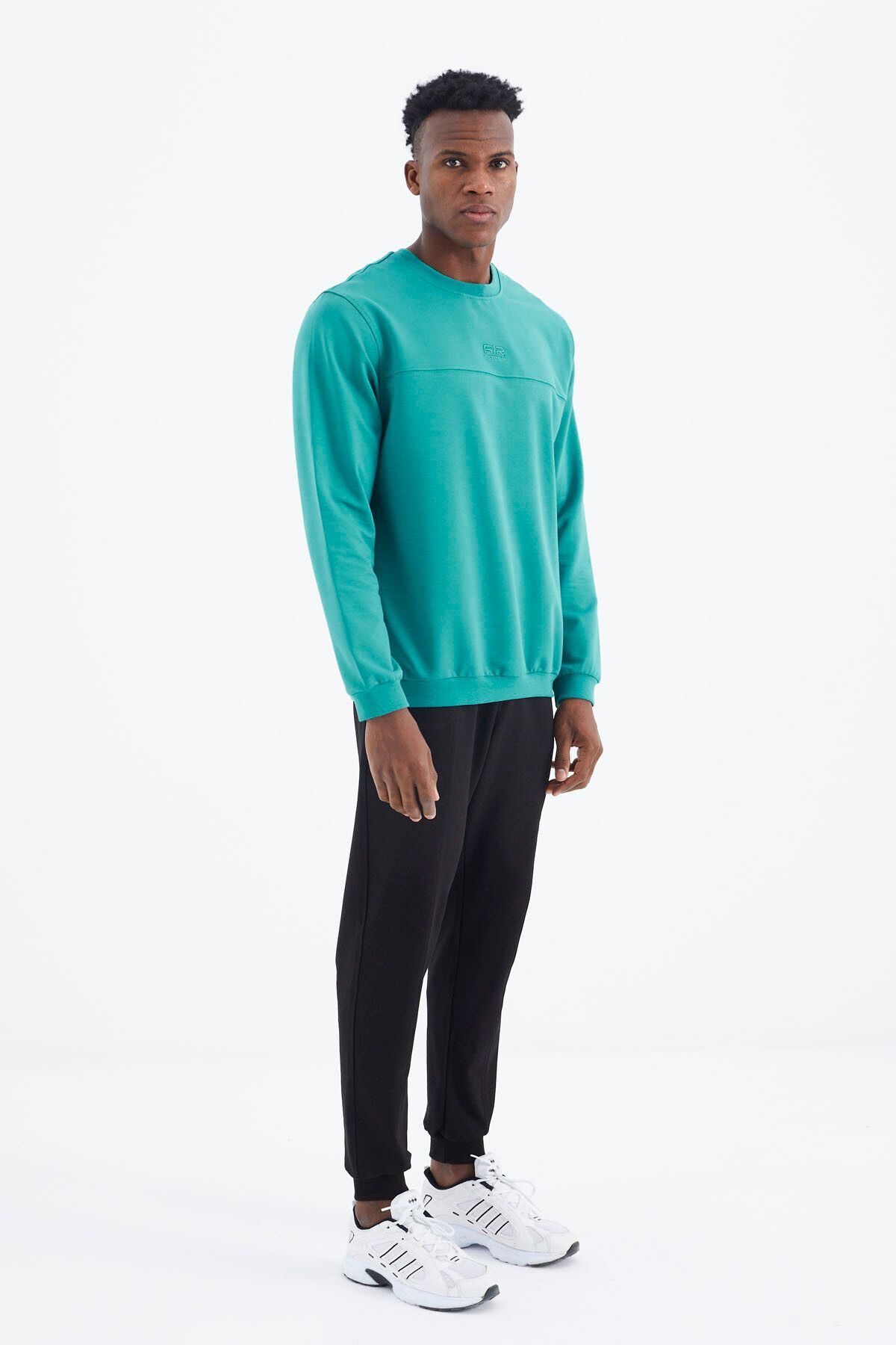 Black and green tracksuit top