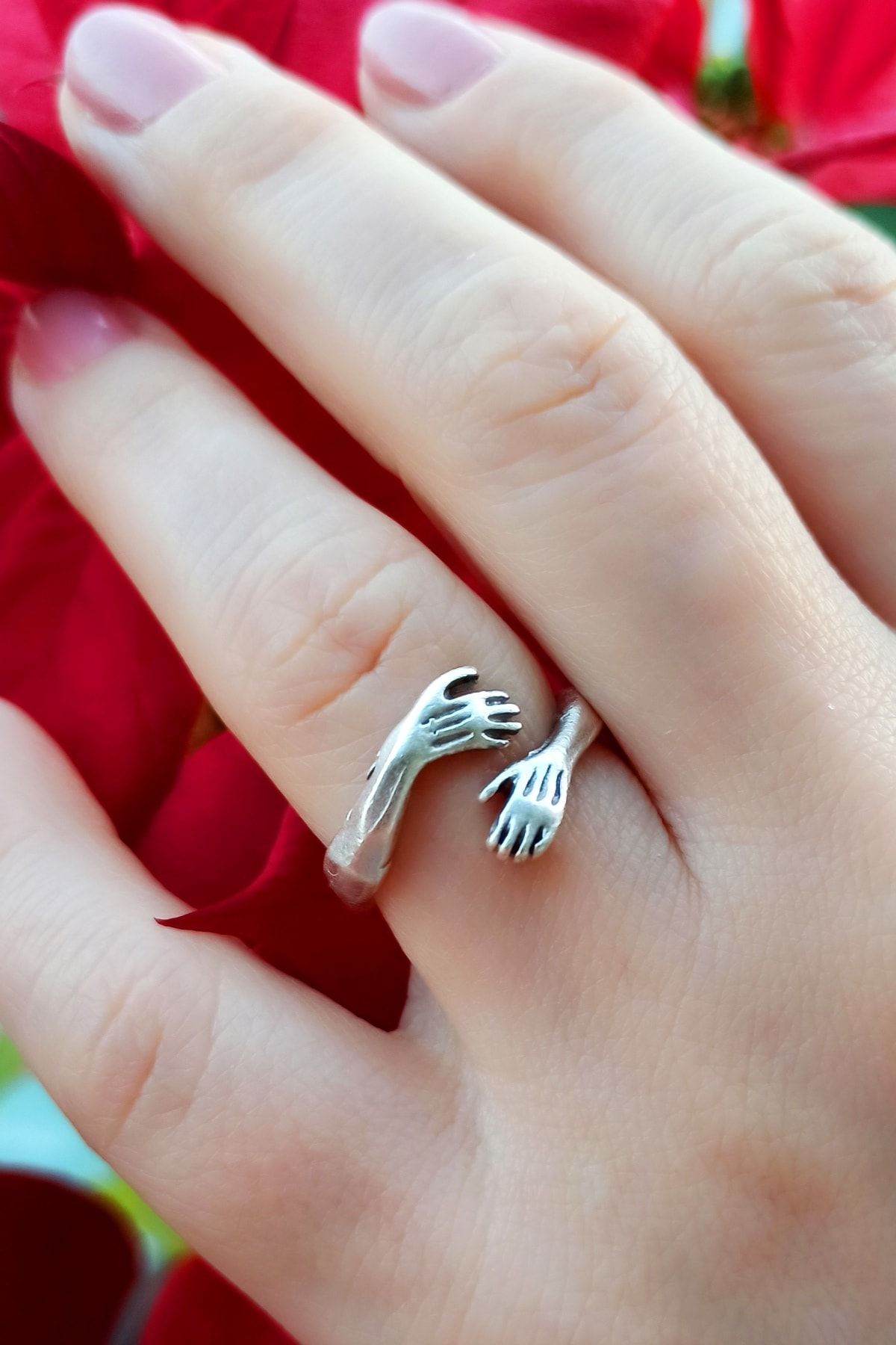 Hands hugging store finger ring