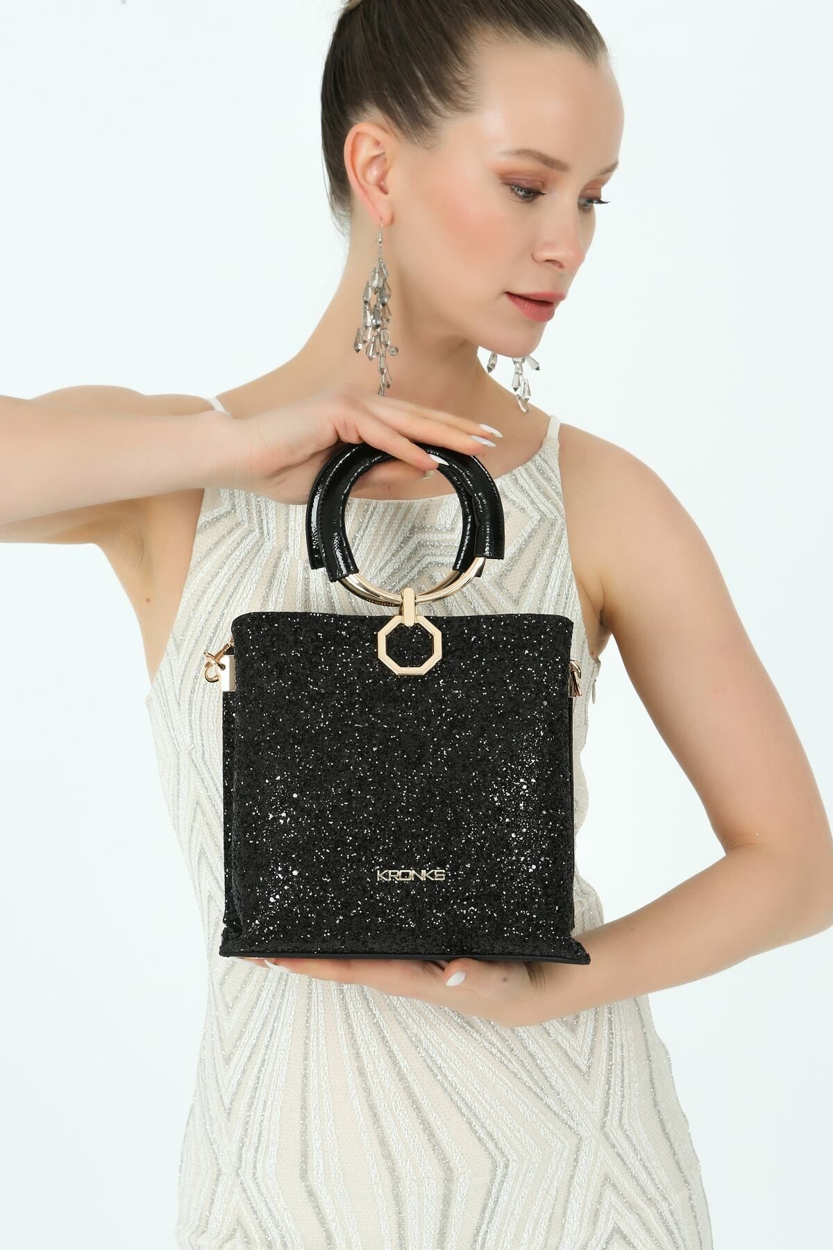 Black bag with online gold shells on strap