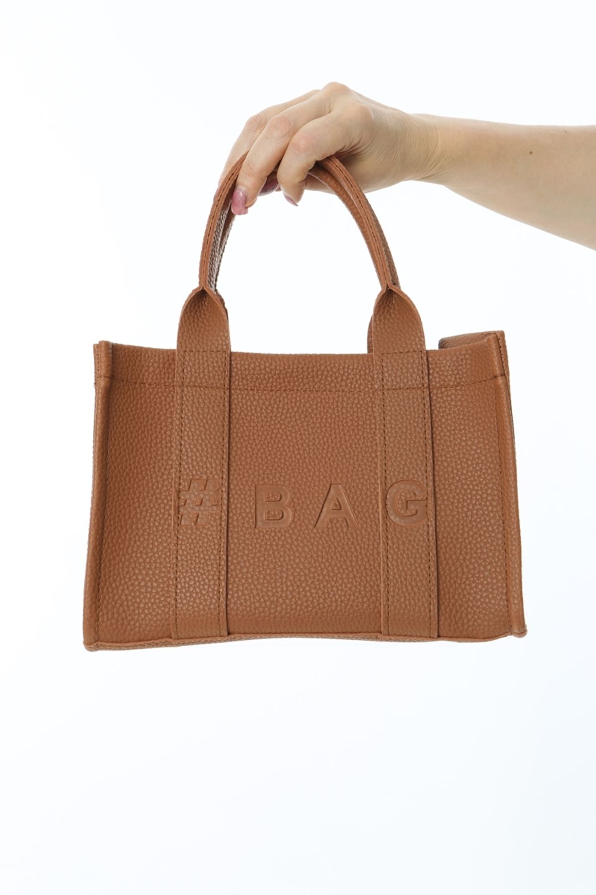 The leather mini traveler tote bag top