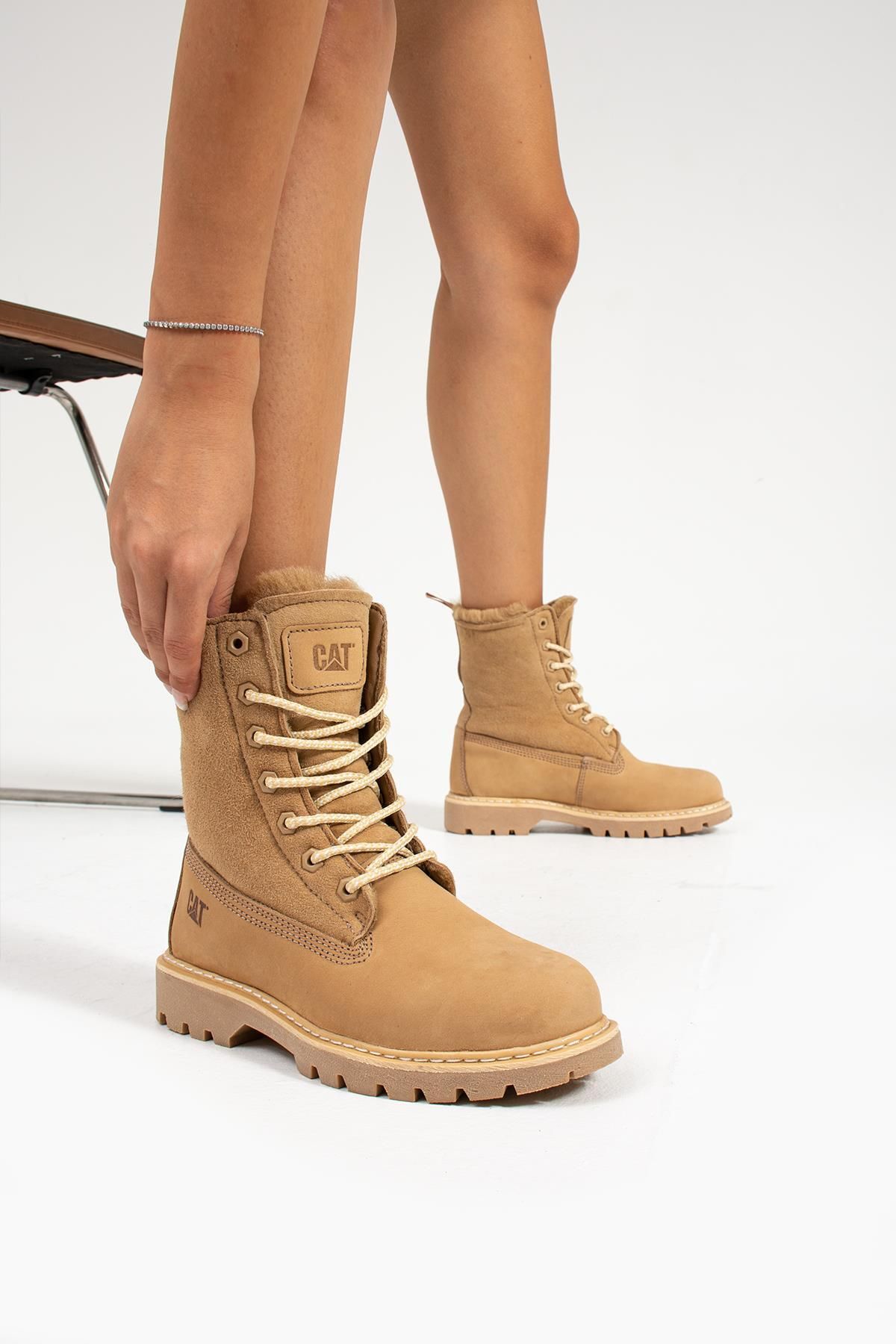Caterpillar wedge boots discount