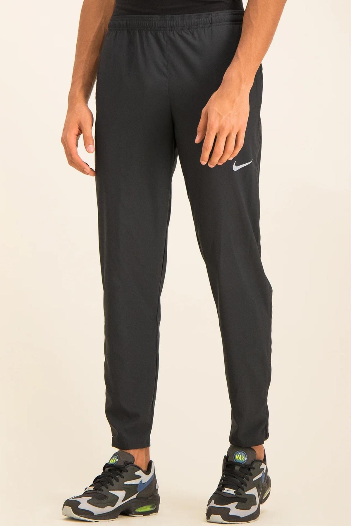 Nike Dri Fit Run Stripe Wvn Standard Cut Men s Black Sweatpants Trendyol