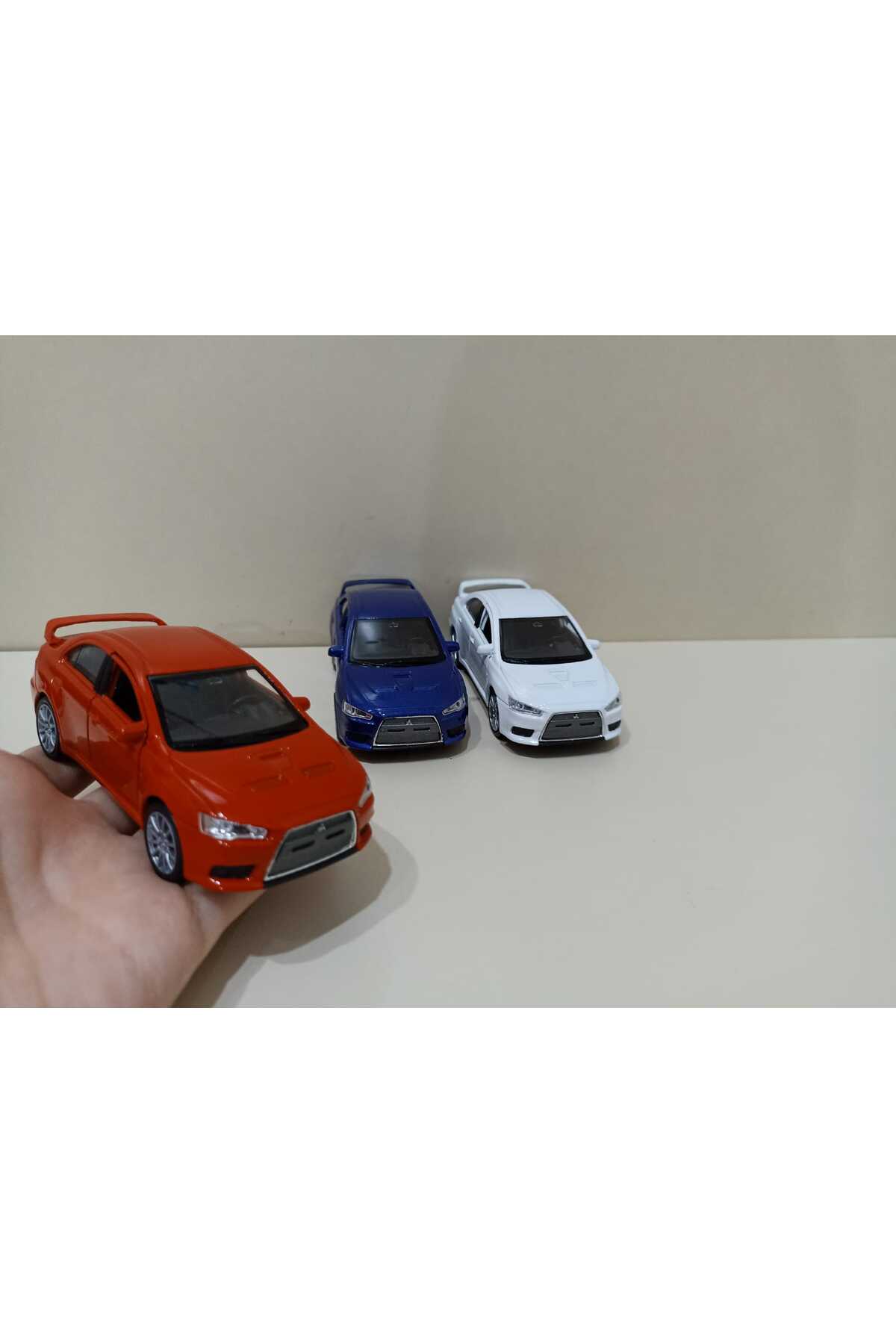 Modellino Auto Welly Mitsubishi Lancer Evo X Blu – Scala 1/34 Con Porte Apribili