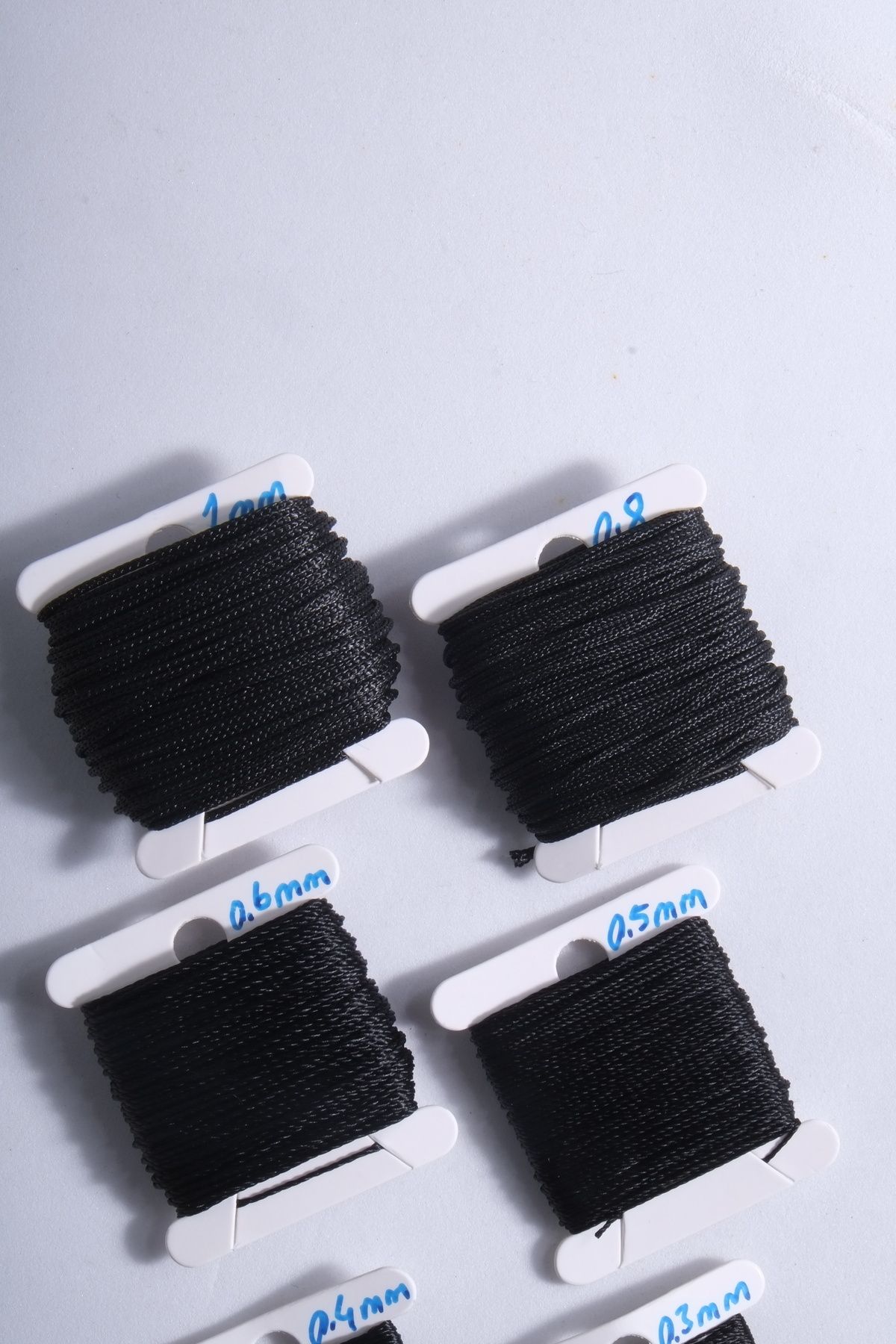 10 Metre 7 Ölçü Tesbih Ipi Seti 0.2 Mm 0.3 Mm 0.4 Mm 0.5 Mm 0.6 Mm 0.8 Mm 1 Mm Siyah Toplam 70 Metre