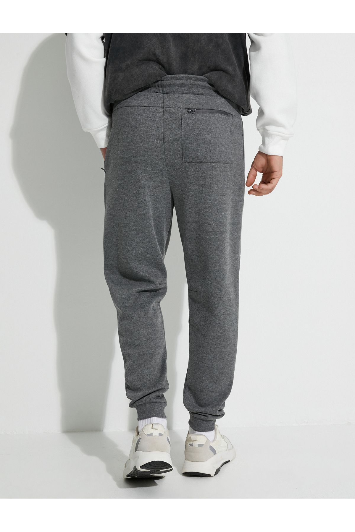 Grey sweatpants with zipper on sale pockets