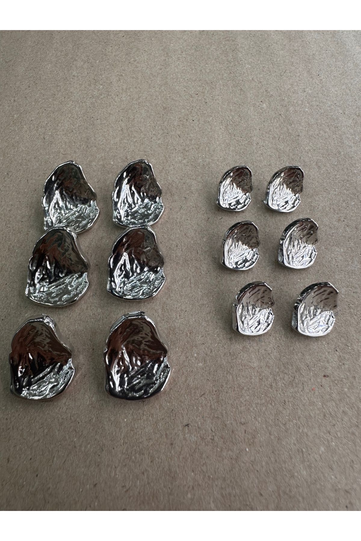 ODDA TASARIM ATÖLYESİ-Asymmetric cambered shell model silver button set 1
