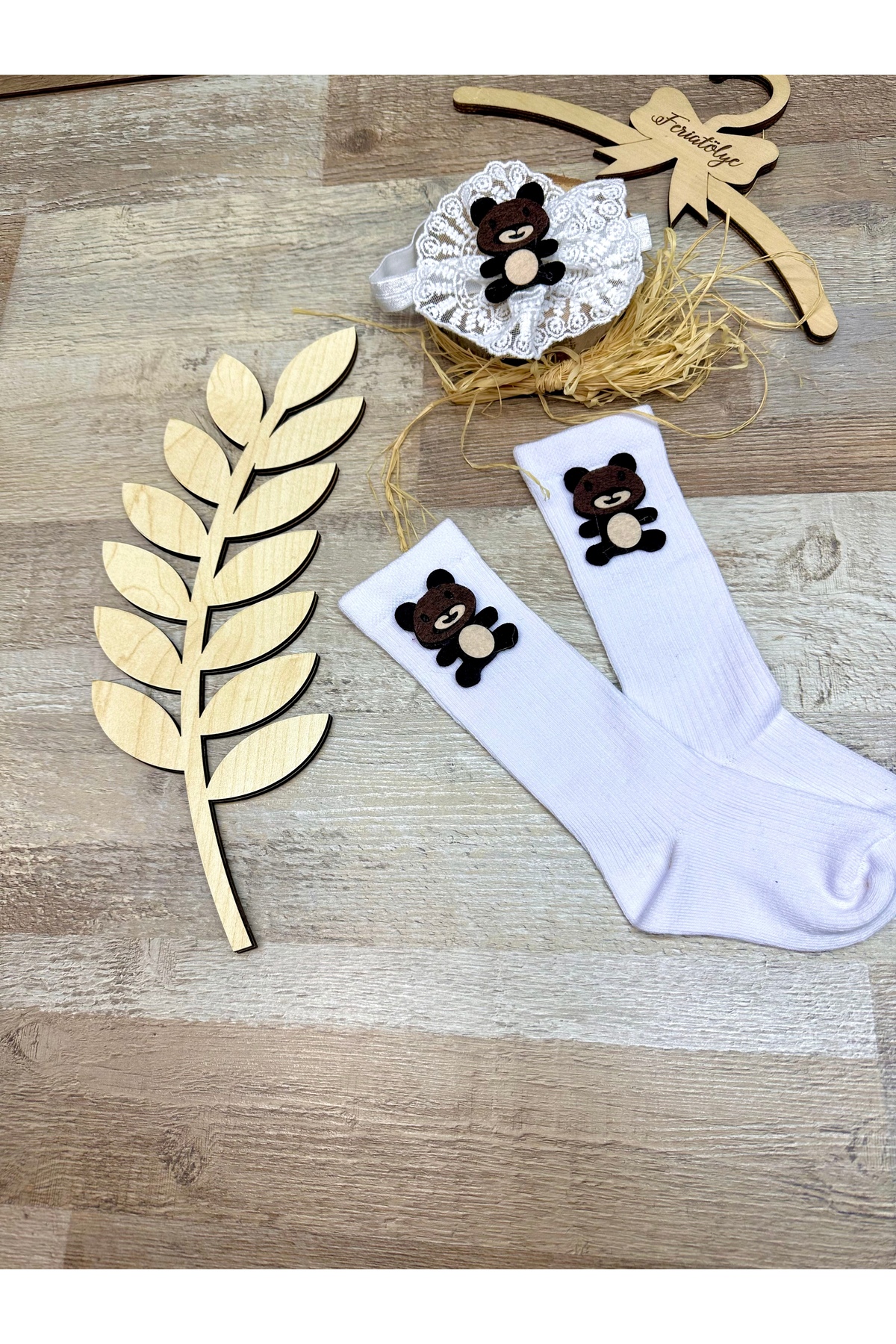 Baby girl with teddy bear figure white lace headband and teddy bear concept below the knee white baby socks