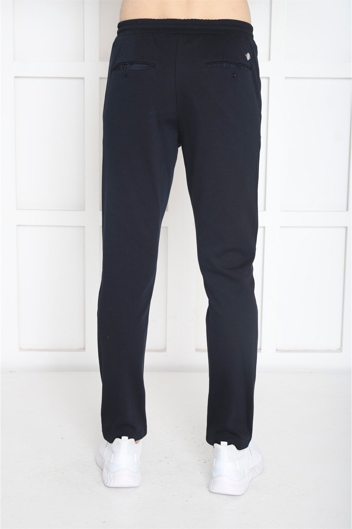 شلوار گرمکن ورزشی مردانه آبی دریایی که به دنبال 4 جیب با ZIPPER SLIMFIT TRATSSUIT SIX B1216 هستند Escetic
