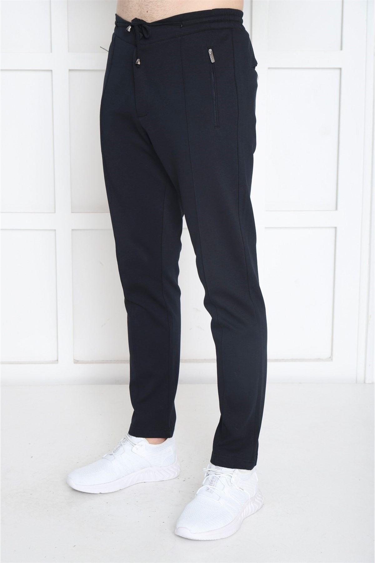 شلوار گرمکن ورزشی مردانه آبی دریایی که به دنبال 4 جیب با ZIPPER SLIMFIT TRATSSUIT SIX B1216 هستند Escetic