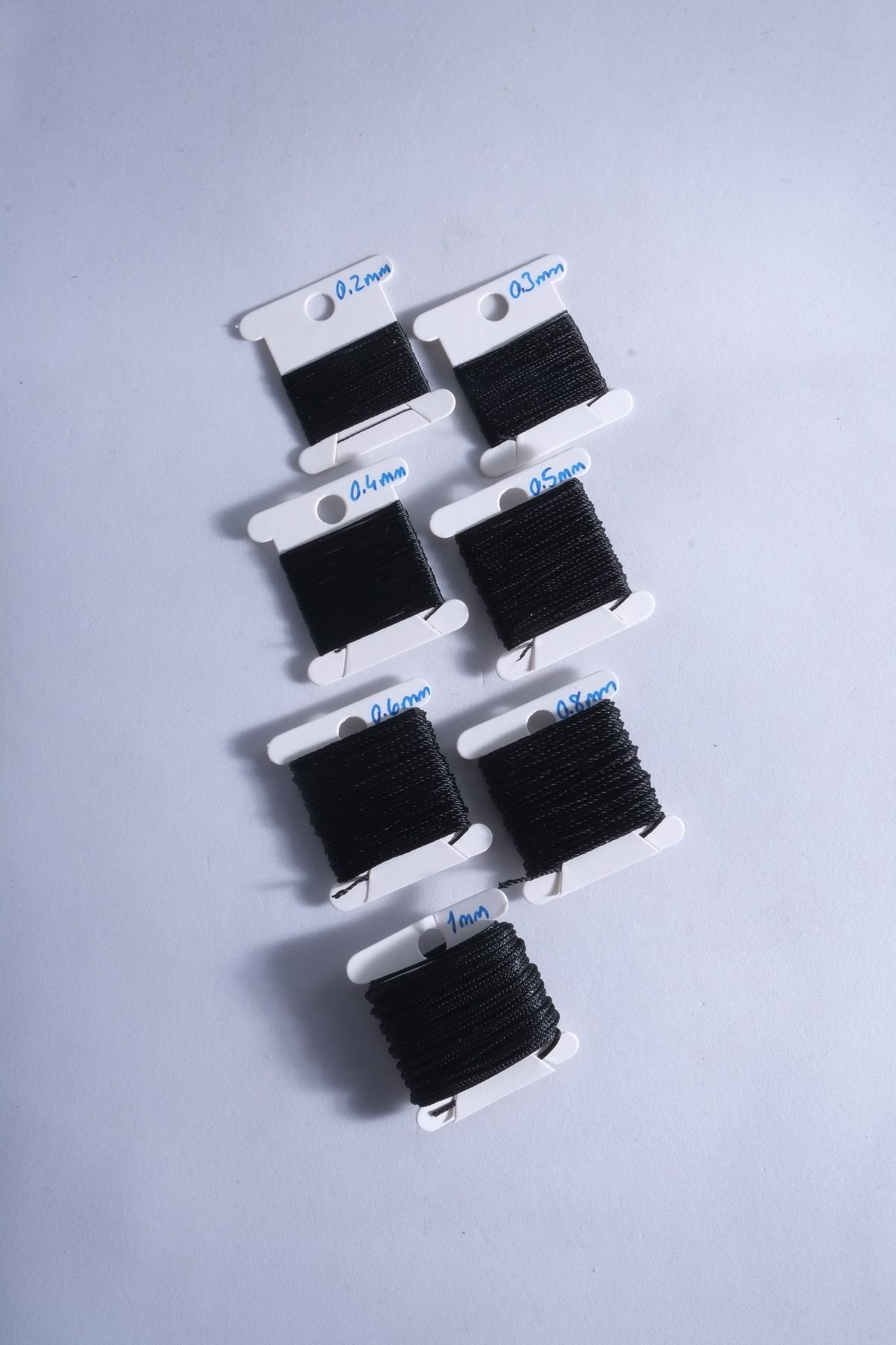 5 Metre 7 Ölçü Tesbih Ipi Seti 0.2 Mm 0.3 Mm 0.4 Mm 0.5 Mm 0.6 Mm 0.8 Mm 1 Mm Siyah Toplam 35 Metre