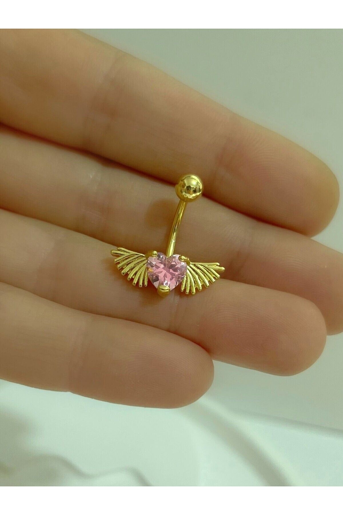 CERRAHİ ÇELİK PEMBE TAŞLI KALPLİ KANATLI GOLD RENK GÖBEK PİERCİNGİ