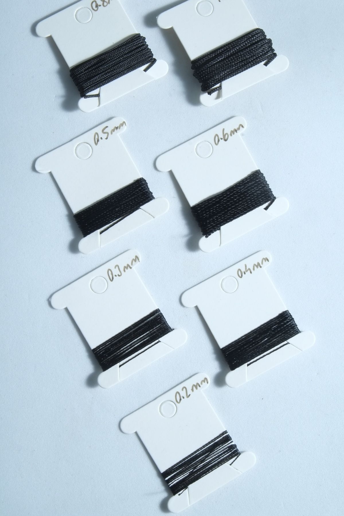 1 Metre 7 Ölçü Tesbih Ipi Seti 0.2 Mm 0.3 Mm 0.4 Mm 0.5 Mm 0.6 Mm 0.8 Mm 1 Mm Siyah Renk