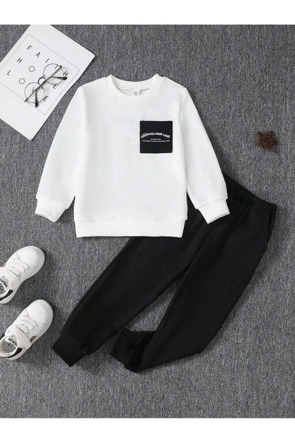 léquipe de coton californienne sweat bogger noir avec une pression dun garçon sur son vélo